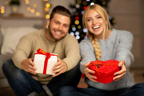 Happy couple celebrating Christmas together at home - Photo, Image