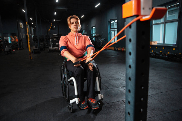 Disabled woman training in the gym of rehabilitation center - Photo, Image