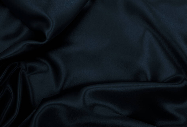 Smooth elegant black silk or satin texture can use as abstract background. Luxurious background design - Foto, Bild