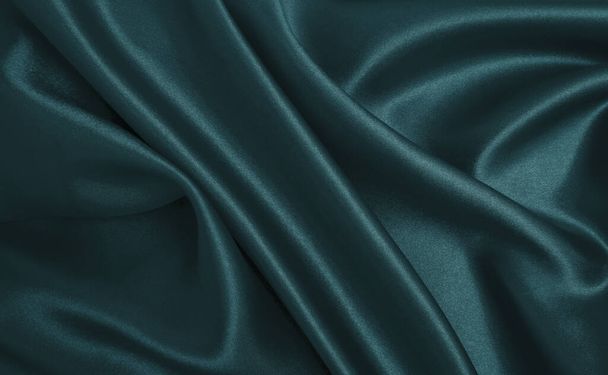Smooth elegant blue silk or satin luxury cloth texture can use as abstract background. Luxurious Christmas background or New Year background design   - Foto, afbeelding