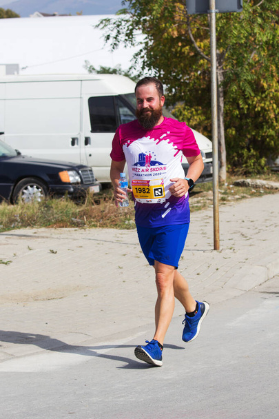 SKOPJE - OCTOBER, 04: Limited number of 1500 registered runners, in  covid-19 pandemic, participate in the WIZZ Air Skopje Marathon on October 04, 2020 in Skopje, Macedonia. Sports event in coronavirus or covid 19 pandemic. - Φωτογραφία, εικόνα