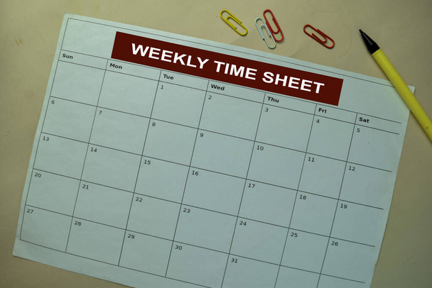 Weekly Time Sheet on monthly Calendar isolated on the table - Photo, Image