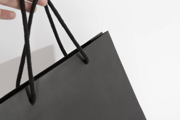 black matte luxury paper bag closeup - Фото, изображение