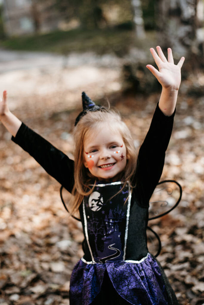 Little girl dressed up as a witch isolated on white - Foto, Imagem