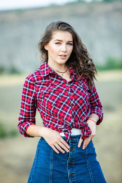 Fashion Portrait of Stylish Pretty Brunette Young Woman Outdoor. Cool hipster student woman. Trendy hipster Russian teenage girl wearing casual clothes. City lifestyle sty - Фото, изображение
