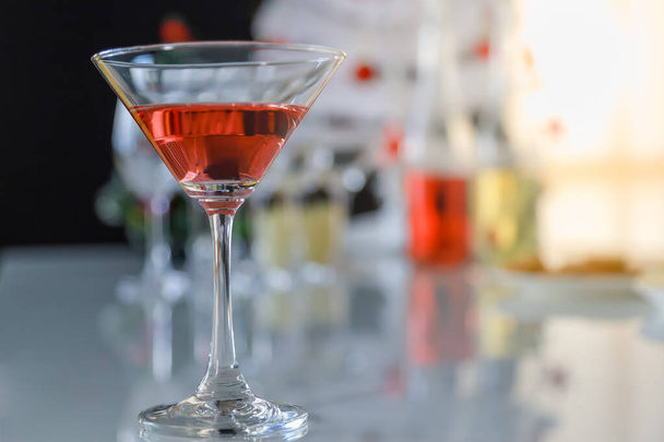 Close up of red cocktail glass on table in party - Photo, Image