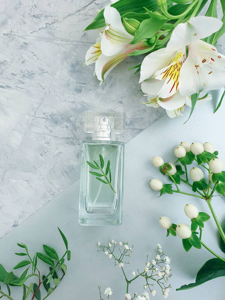 bottle perfume flower on a concrete background - Photo, Image