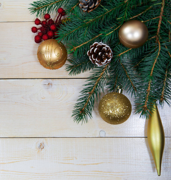 Christmas tree branches with cones , balls and snowflakes on a white background. Merry Christmas and happy New year composition. Decorative flat composition, top view, copy space - 写真・画像