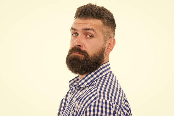 Trust your barber. Facial hair. Hipster with long beard and stylish hair on white background. Brutal guy with shaped beard and mustache hair. Bearded man with unshaven face hair. Services for men - Photo, Image