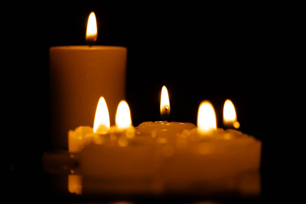 Candles burning at night. Selective focus. dark background - Photo, image
