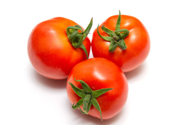 Bright red ripe tomatoes with ponytails isolated on white background - Fotó, kép