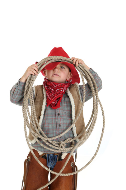 Funny pose of a young cowboy holding a rope - Fotografie, Obrázek