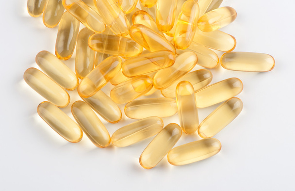 Omega 3 gel capsules on white background - Фото, изображение