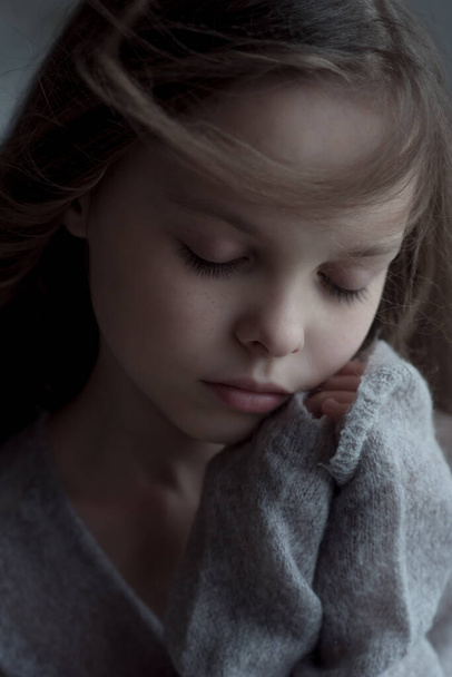 Portrait of beautiful little child girl with closed  eyes. Facial expression. Kid and emotions. - Foto, afbeelding
