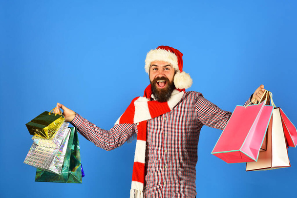 Santa with colorful packets. Christmas shopping and sale concept - Zdjęcie, obraz