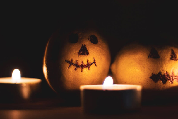  Halloween jack o lantern and candles in the dark - Photo, Image
