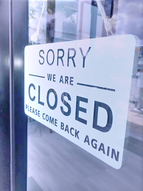 The sign of the coffee shop shows a temporary closure due to the coronavirus outbreak. - Photo, Image
