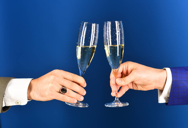 Corporate Christmas party concept. Businessmen raising toast with champagne - Photo, Image