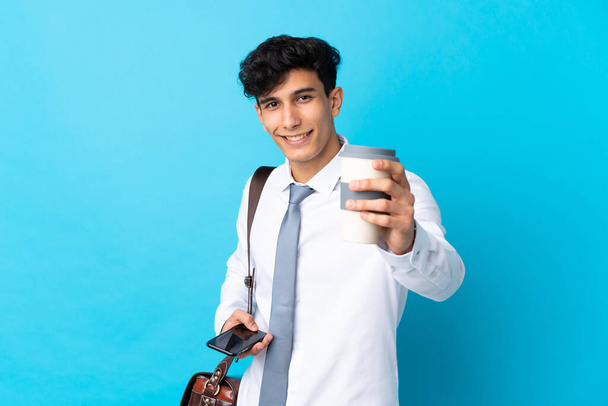 Young Argentinian businessman over isolated blue background - Foto, Imagen