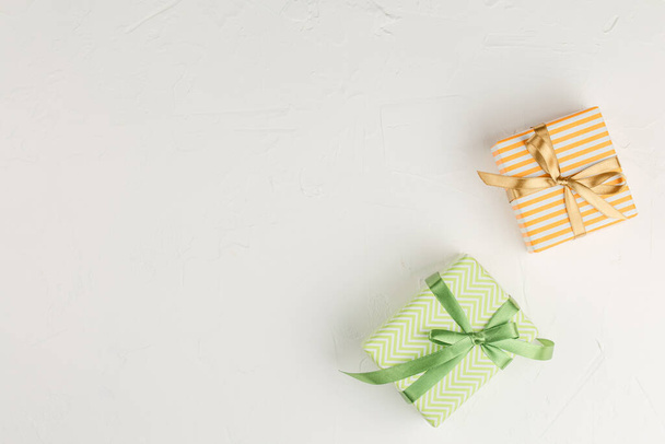 Gift box with ribbon on white background top view. - Photo, Image