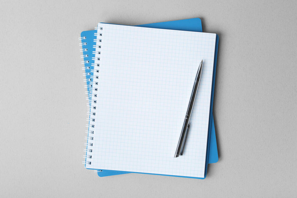 open notebook with pen on a gray background - Photo, Image