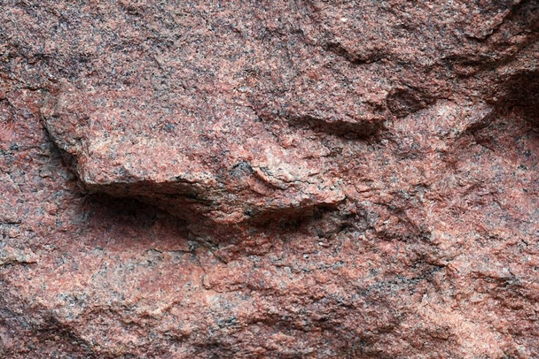 Geïsoleerd roze oppervlak van natuursteen (graniet)) - Foto, afbeelding