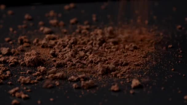 Shooting of falling instant coffee on black background - Séquence, vidéo