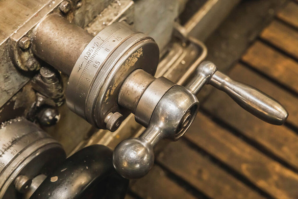 old polished drilling machine control handle close-up - Φωτογραφία, εικόνα