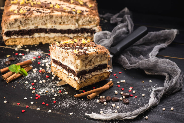 Sweet cake with layers on black background - Foto, Imagem