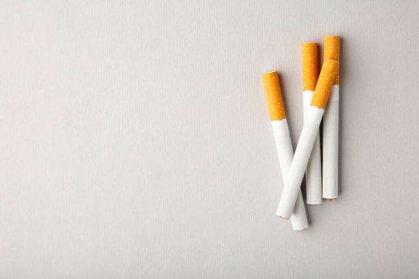 Cigarettes on grey background with copy space. Top view. - Photo, image