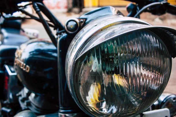 Closeup of a motorcycle rolling in the streets of the city center of the metropolitan area - Photo, Image