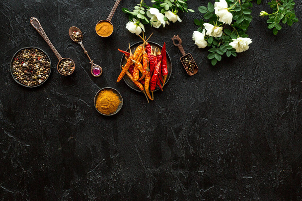 A set of fragrant hot spices - pepper and paprika with herbs, top view - Photo, Image