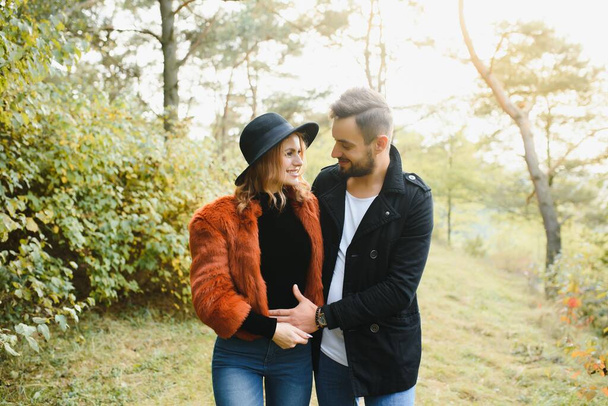 happy young couple in love outdoor in autumn - Фото, изображение