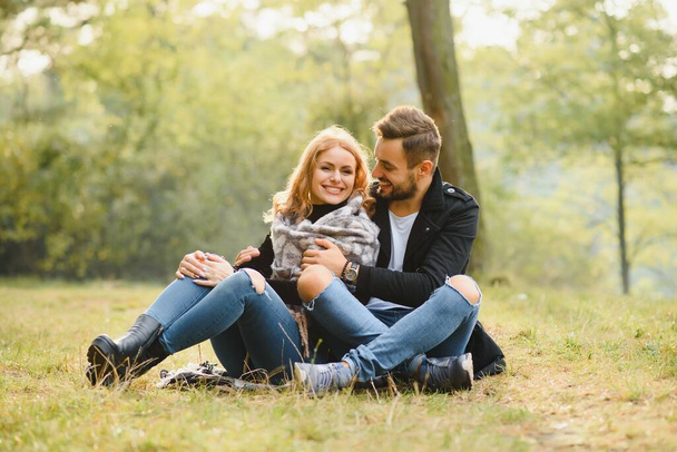 happy young couple in love outdoor in autumn - Фото, изображение