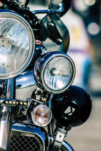 Closeup of a motorcycle rolling in the streets of the city center of the metropolitan area - Foto, Imagem