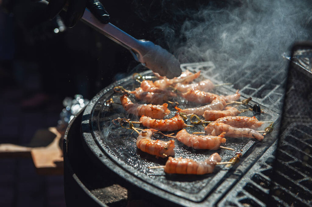 A professional cook prepares shrimps - Photo, Image