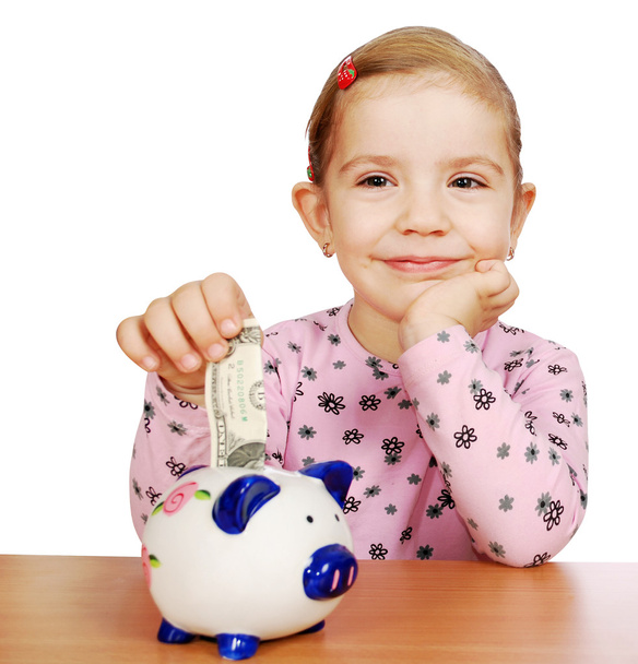 Little girl with piggy bank - Photo, Image