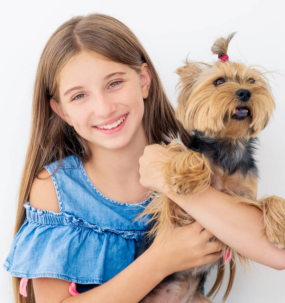 Girl holding terrier dog - Foto, immagini