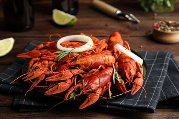 Delicious red boiled crayfishes on table, closeup - Фото, изображение