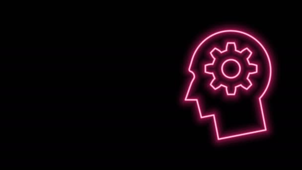 Gloeiende neon lijn Menselijk hoofd met vistuig binnen pictogram geïsoleerd op zwarte achtergrond. Kunstmatige intelligentie. Denkende hersenen. Symbolisch werk van hersenen. 4K Video motion grafische animatie - Video