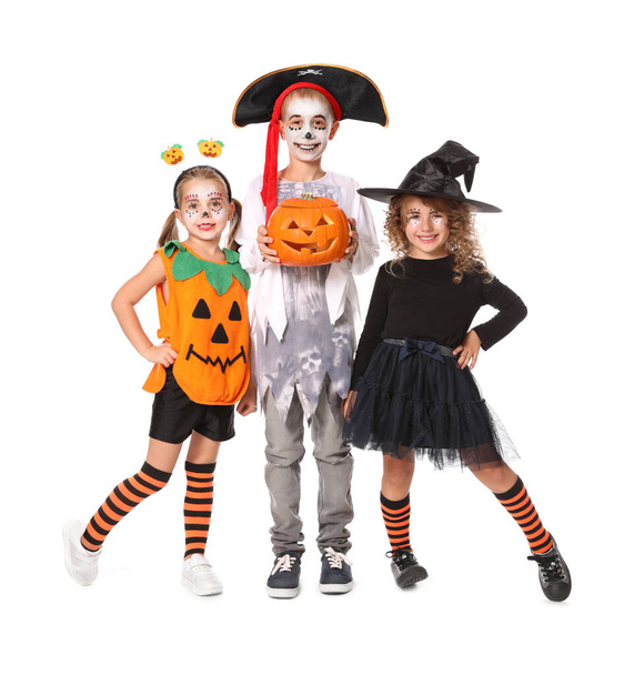 Cute little kids with pumpkin head jack lantern wearing Halloween costumes on white background - Valokuva, kuva