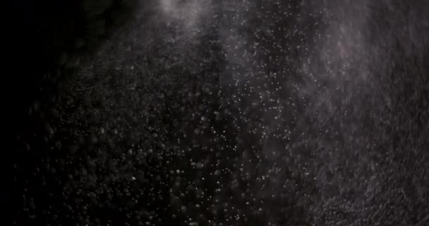 Polvo aislado sobre fondo negro - Metraje, vídeo