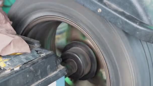 Wheel Balancing Machine or Wheel Balancer and Balance Pad Running in Zoom View - Footage, Video
