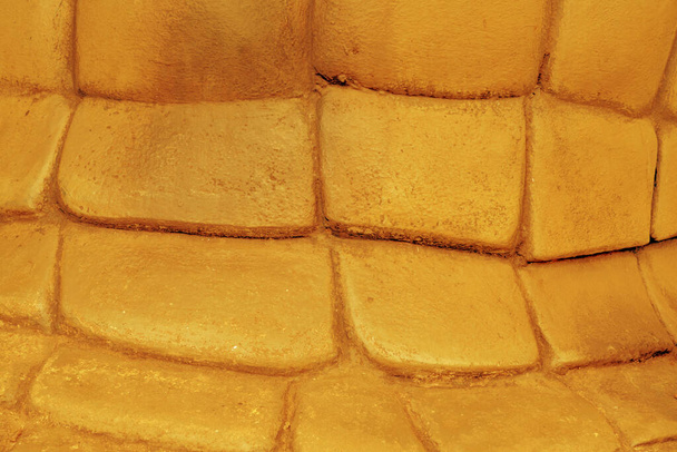 Golden stone wall construction background - Fotoğraf, Görsel