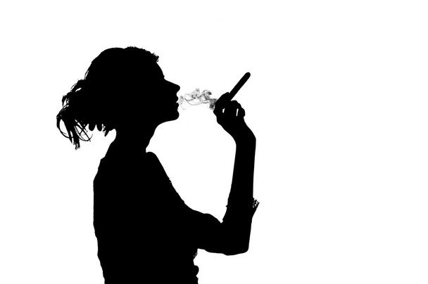 Silhouette of smoking woman - Foto, Imagen