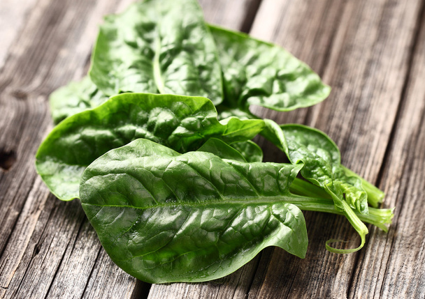Spinach leaves on a wooden background - Photo, image