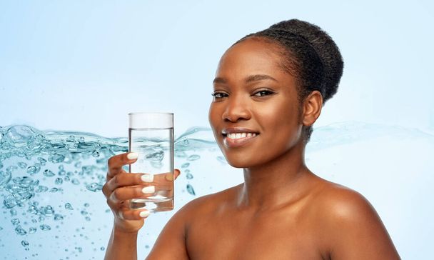 young african american woman with glass of water - Photo, Image