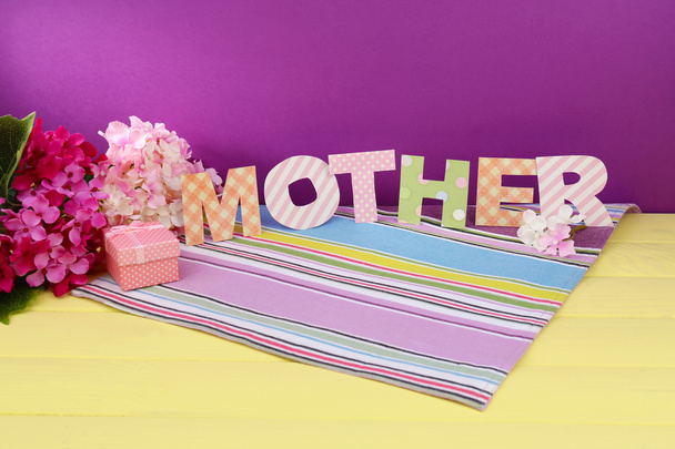 Mother- lettering of handmade paper letters on purple background - Foto, Imagem