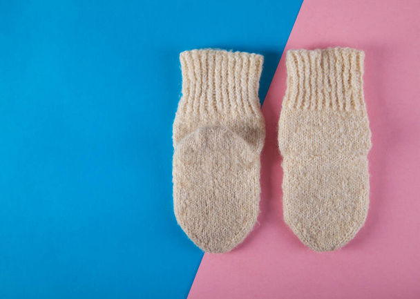 Winter warm socks on an isolated pink and blue background. Child socks. - Fotografie, Obrázek