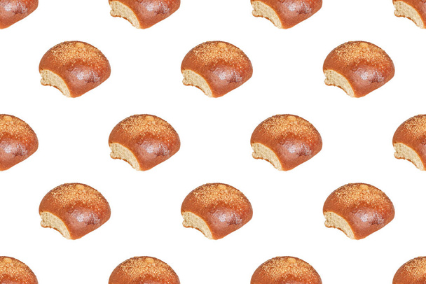 Seamless pattern from butter brown rolls on a light background. Diagonal lines - Фото, зображення